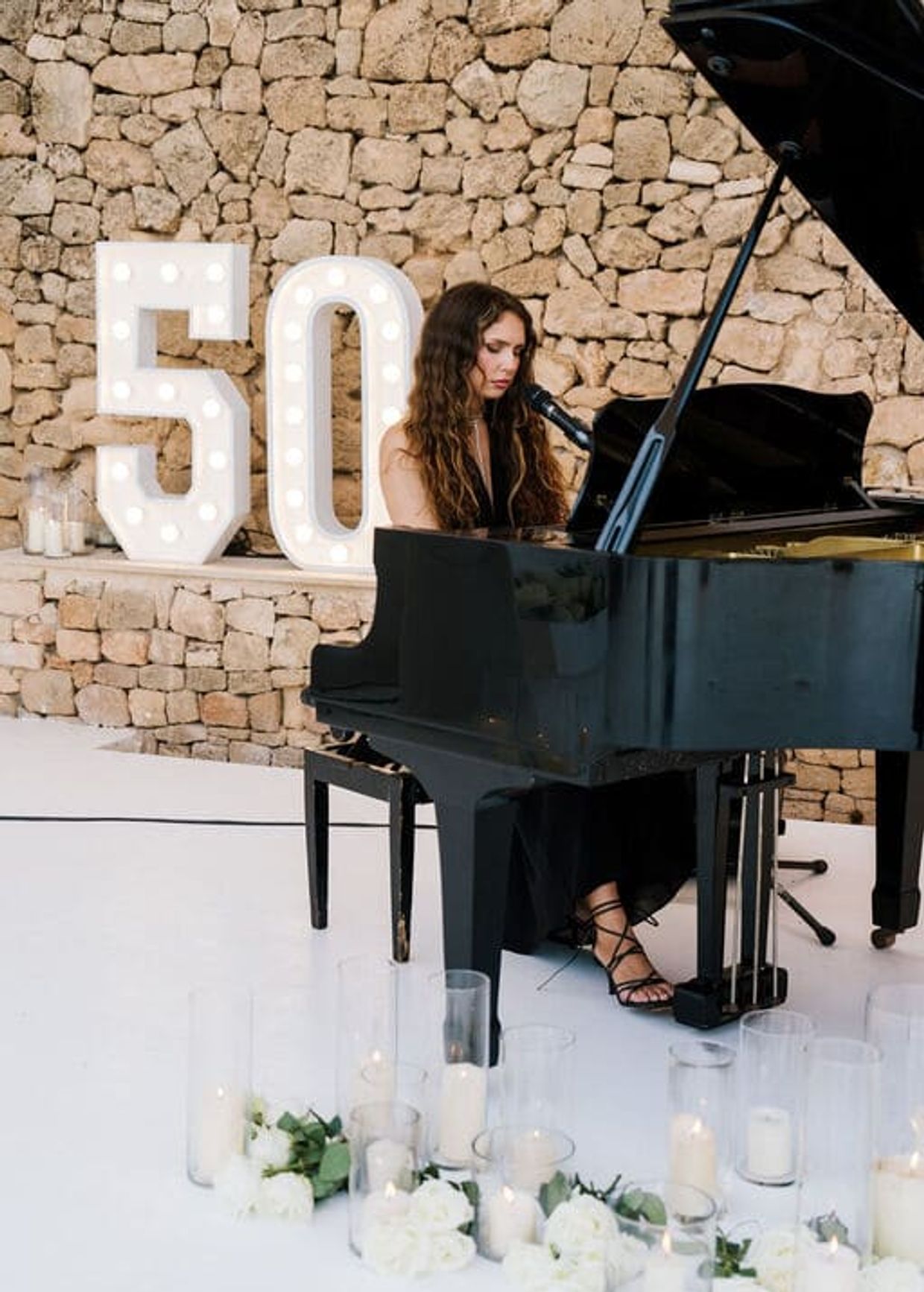 This is an image of a private event in ibiza and pianist performing